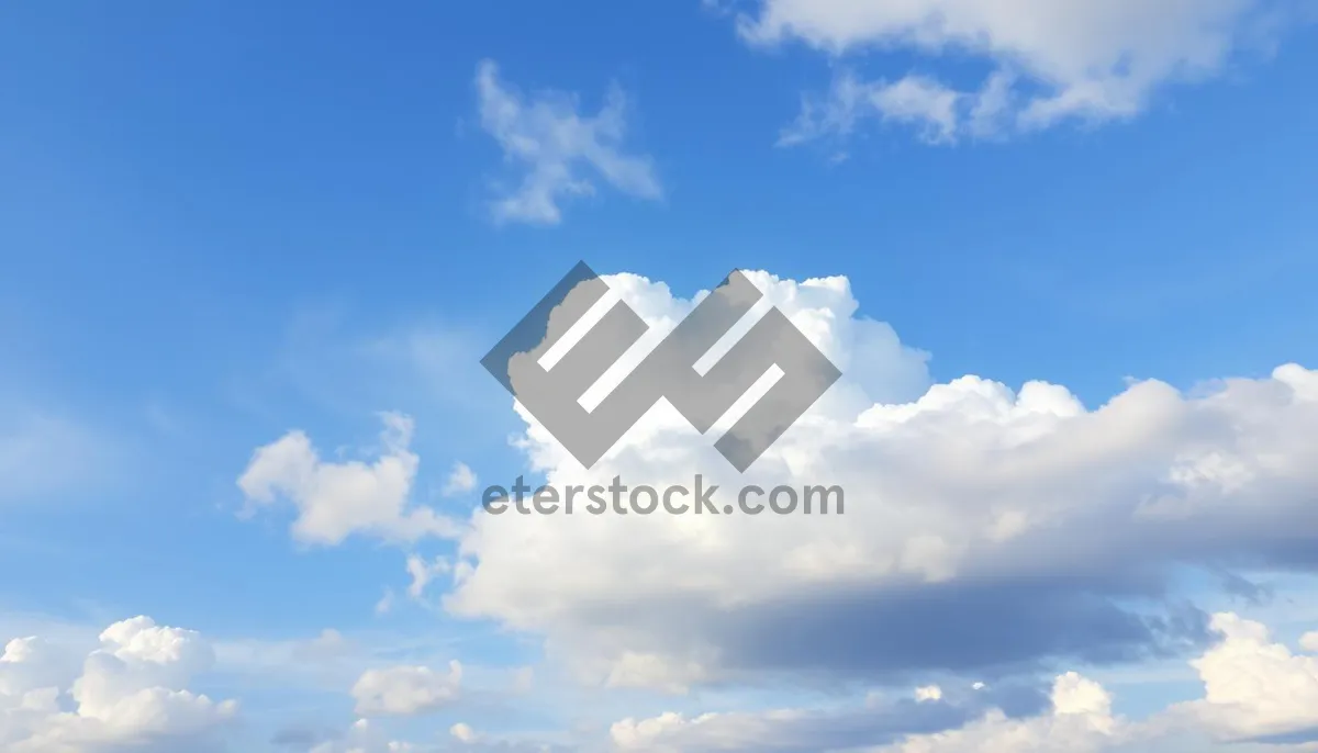 Picture of Bright summer sky with fluffy white clouds.