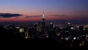 City skyline at night reflecting on river