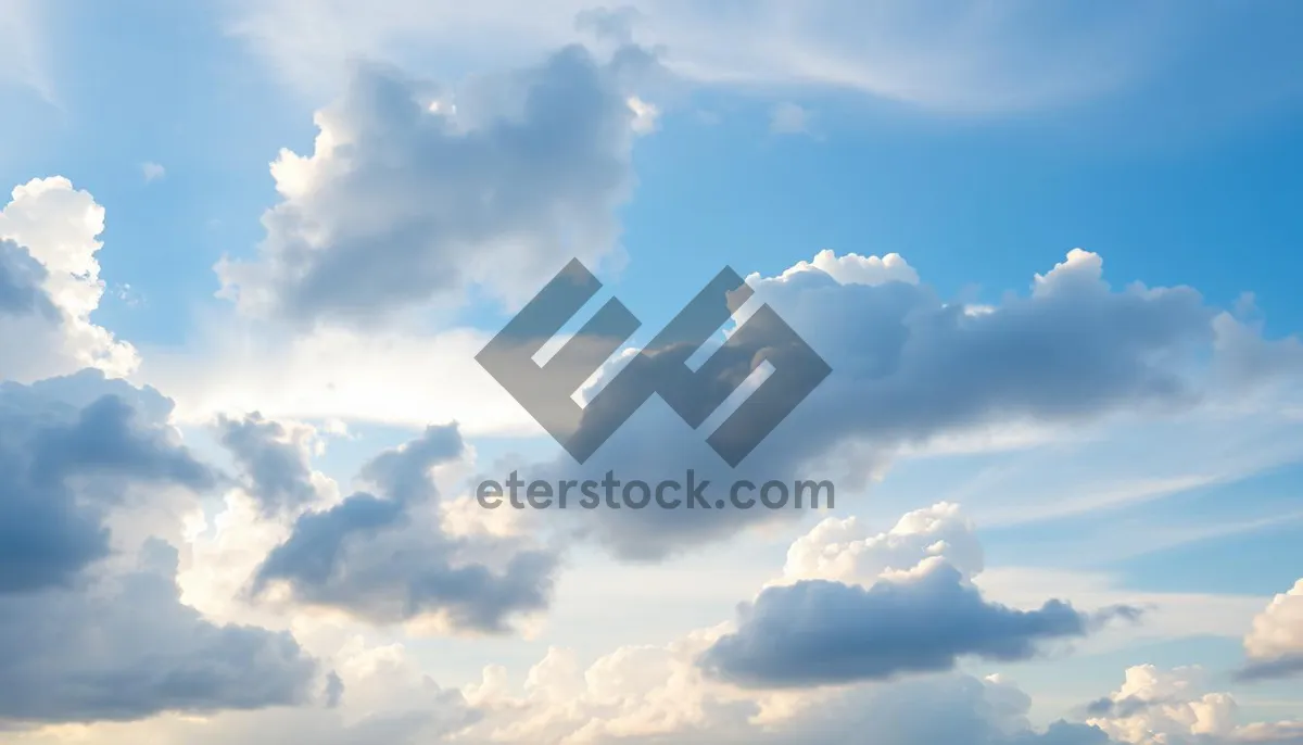 Picture of Bright Sunny Sky with Fluffy Clouds Scenic Landscape