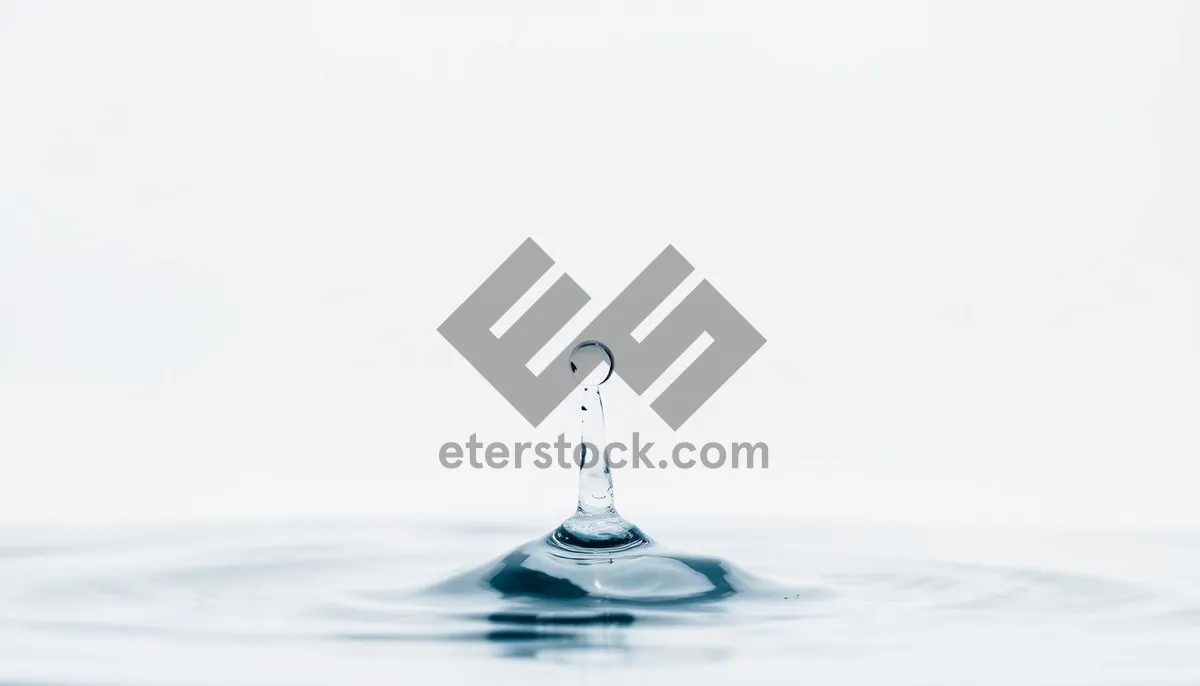 Picture of Clear wine glass with water drops splashing