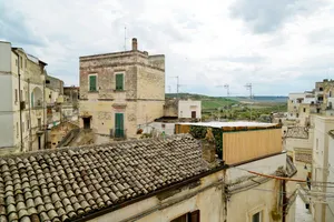 Medieval stone castle with tile roof in historic town.