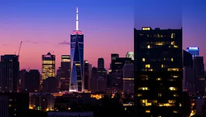 Modern skyline at dusk with illuminated office buildings.