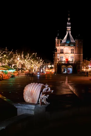 Historic Cathedral Tower Illuminated in Night Sky