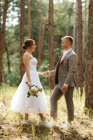 Happy wedding couple enjoying outdoor celebration in the summer