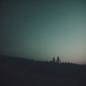 Majestic Sunset Over Snowy Forest Landscape