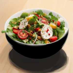 Fresh gourmet salad with vegetables and cheese.