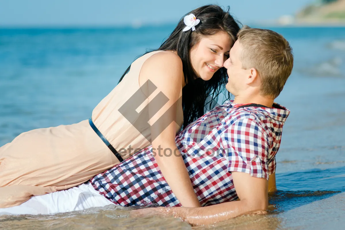 Picture of Happy family on summer vacation at the beach