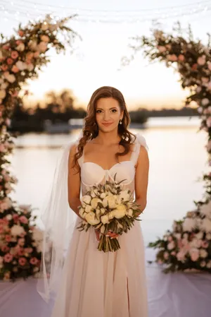 Attractive bride deity smiling happily with flowers