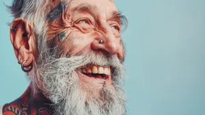 Happy elder man with mustache and beard smiling portrait.