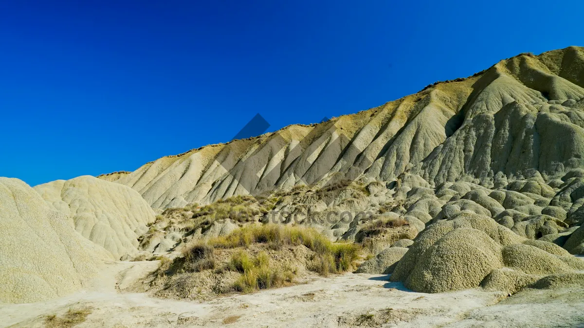 Picture of Protective Roof Over Desert Mountain Range Under Blue Sky