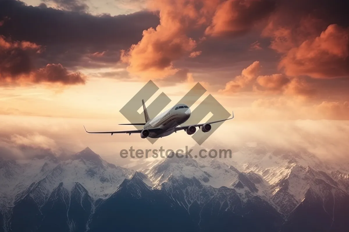 Picture of High-speed business jet flying through fluffy clouds.