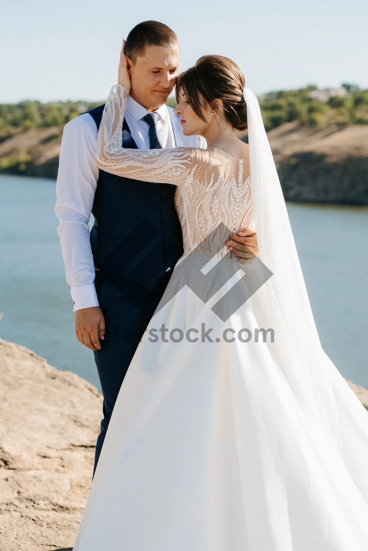 Picture of Happy bride and groom posing on wedding day