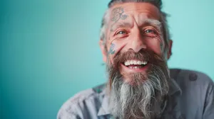 Happy elderly man with gray hair smiling portrait.