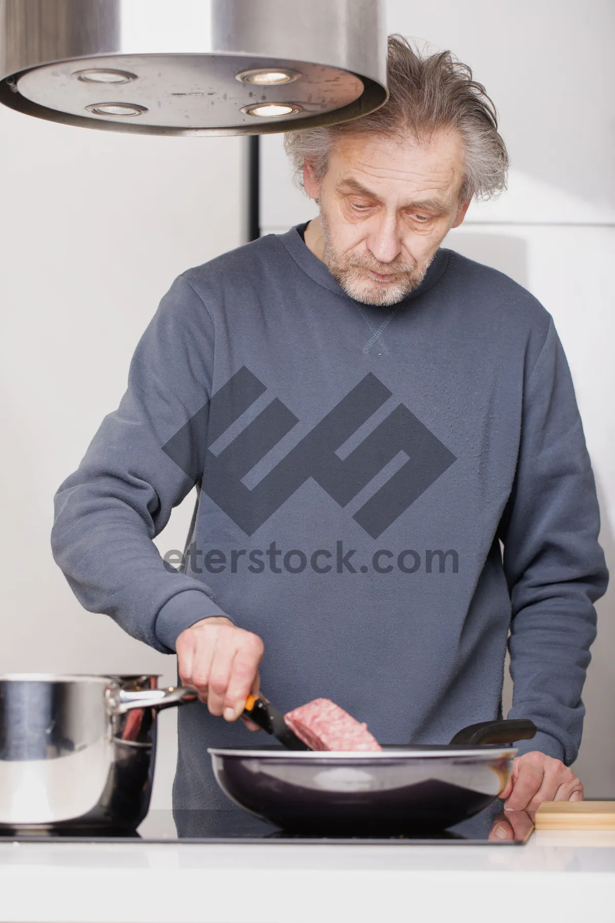 Picture of Happy Senior Man Smiling at Computer at Home