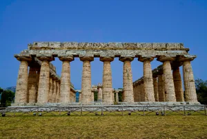 Ancient Roman Temple Columns in Historic City Skyline