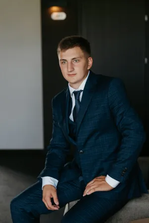 Attractive businessman smiling in office setting