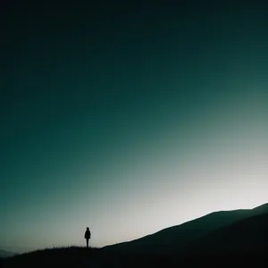 Sunset Mountain Landscape Silhouette Over Desert Horizon