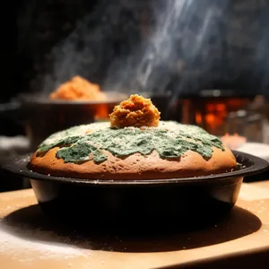 Japanese-style meal with wok and cup in restaurant