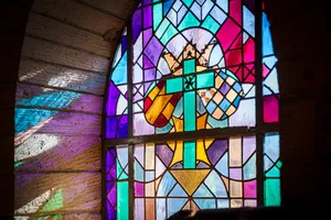 Colorful stained glass window in cathedral.