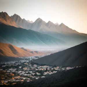 Majestic Snow-capped Mountain Range and Glacial Valley