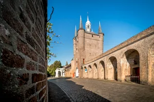 Historic church tower in ancient cityscape.