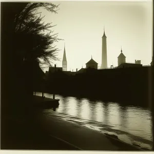 Nighttime Majesty: Historic Cathedral Tower Reflecting in River