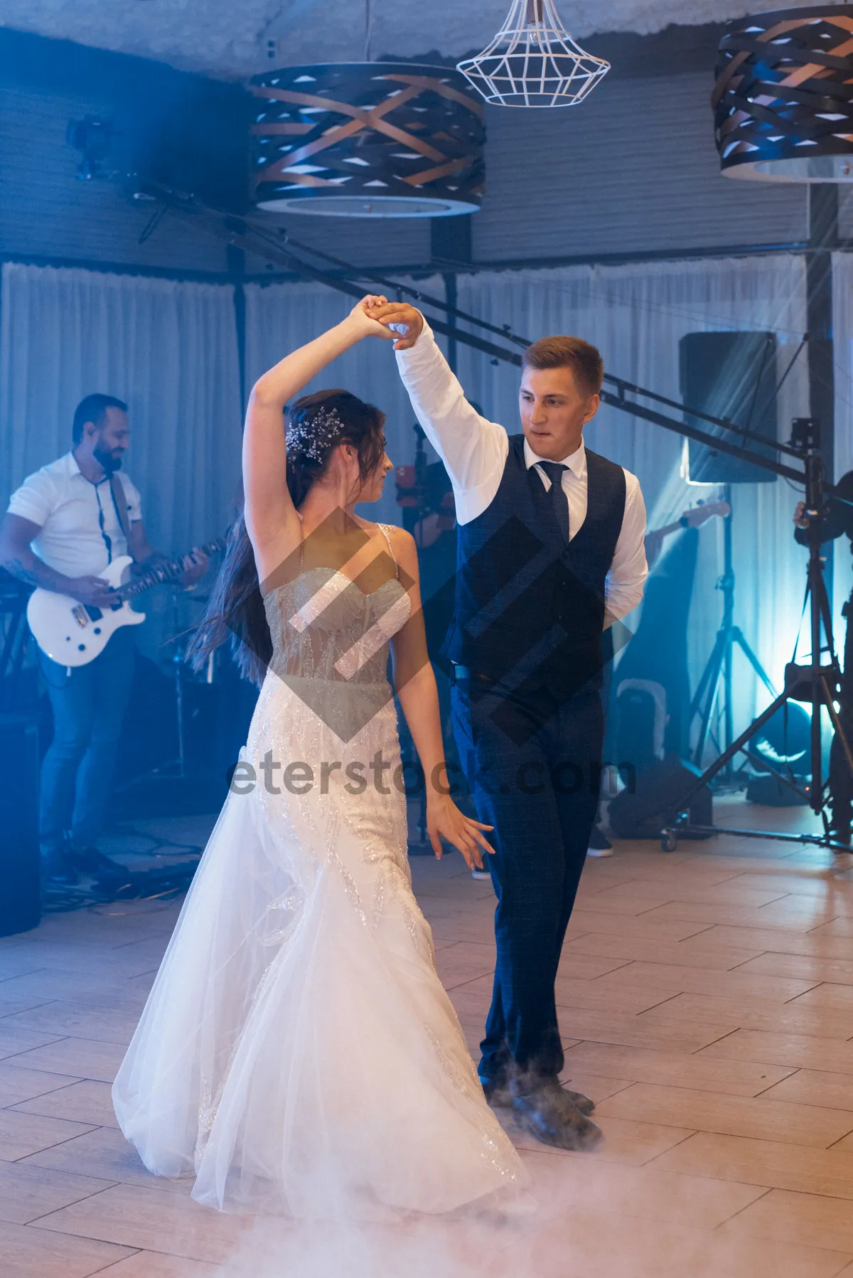 Picture of Happy groom and bride smiling on wedding day