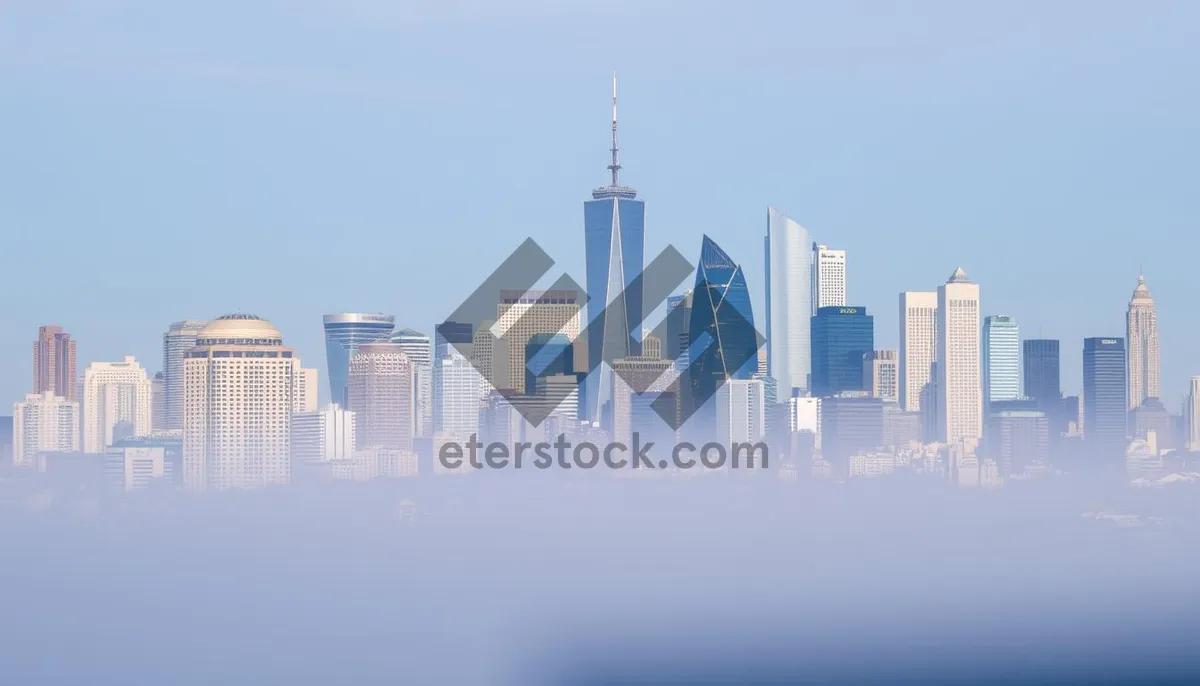 Picture of Modern city skyline at night with waterfront reflection.