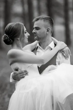 Happy bride and groom smiling outdoors