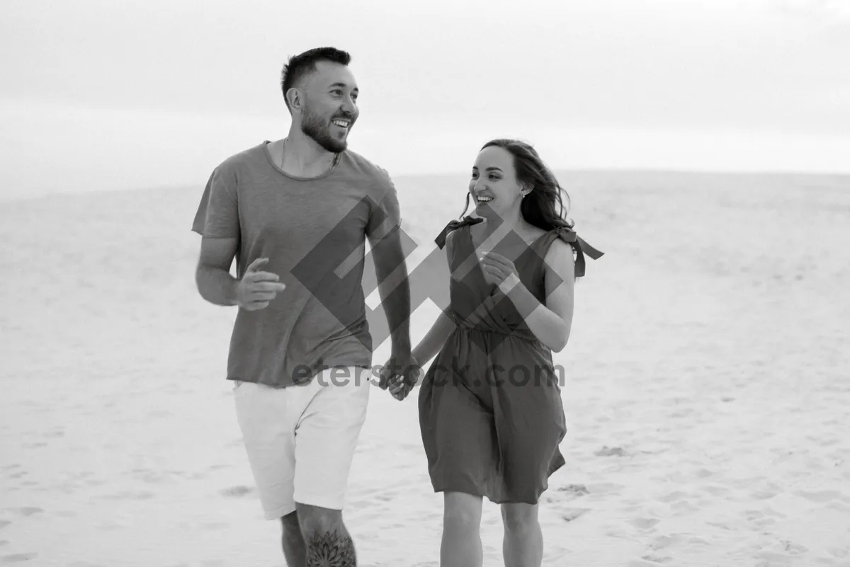 Picture of Happy family walking on the tropical beach shore