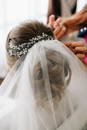 Happy bride and groom with bouquet at wedding