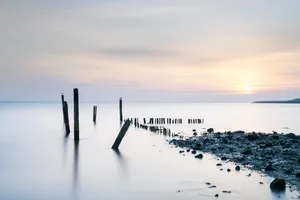 Sunset over the shimmering ocean at the beach