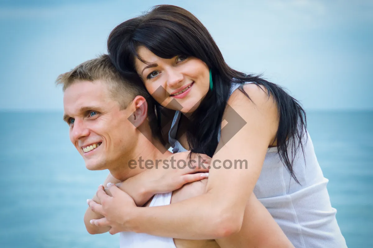 Picture of Happy couple embracing in a loving hug.