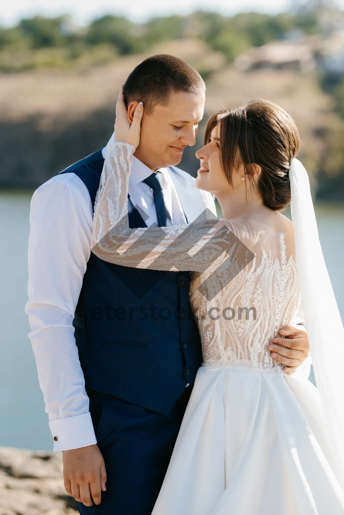 Picture of Happy couple in wedding attire, smiling together