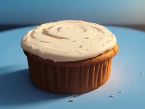 Pink chocolate cupcake with creamy icing and sprinkles.