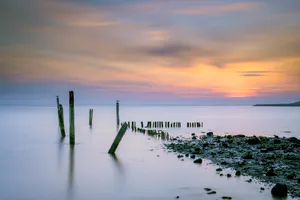 Tranquil Sunset over the Ocean at the Pier