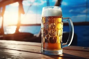 Golden beer mug closeup with frothy bubbles