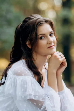 Smiling brunette lady in the park during summer