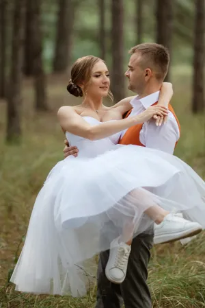 Father and daughter smiling in the park