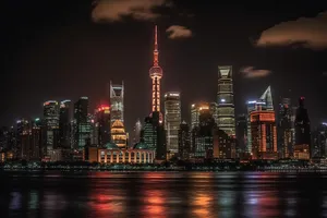 Modern skyscrapers reflecting in the night river.