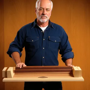 Professional man playing marimba at office desk.