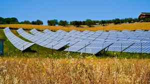 Rural landscape with solar panels reflecting the sun