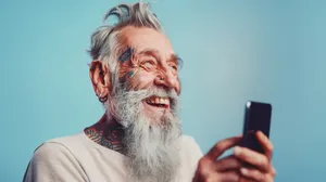 Happy elderly man with gray mustache smiling portrait.