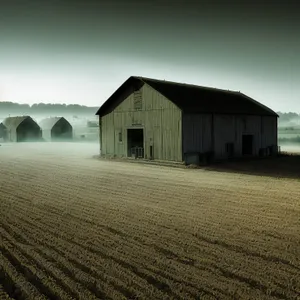 Old rural barn in a landscape with trees