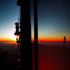 Vibrant Sunset Silhouette Over Ocean