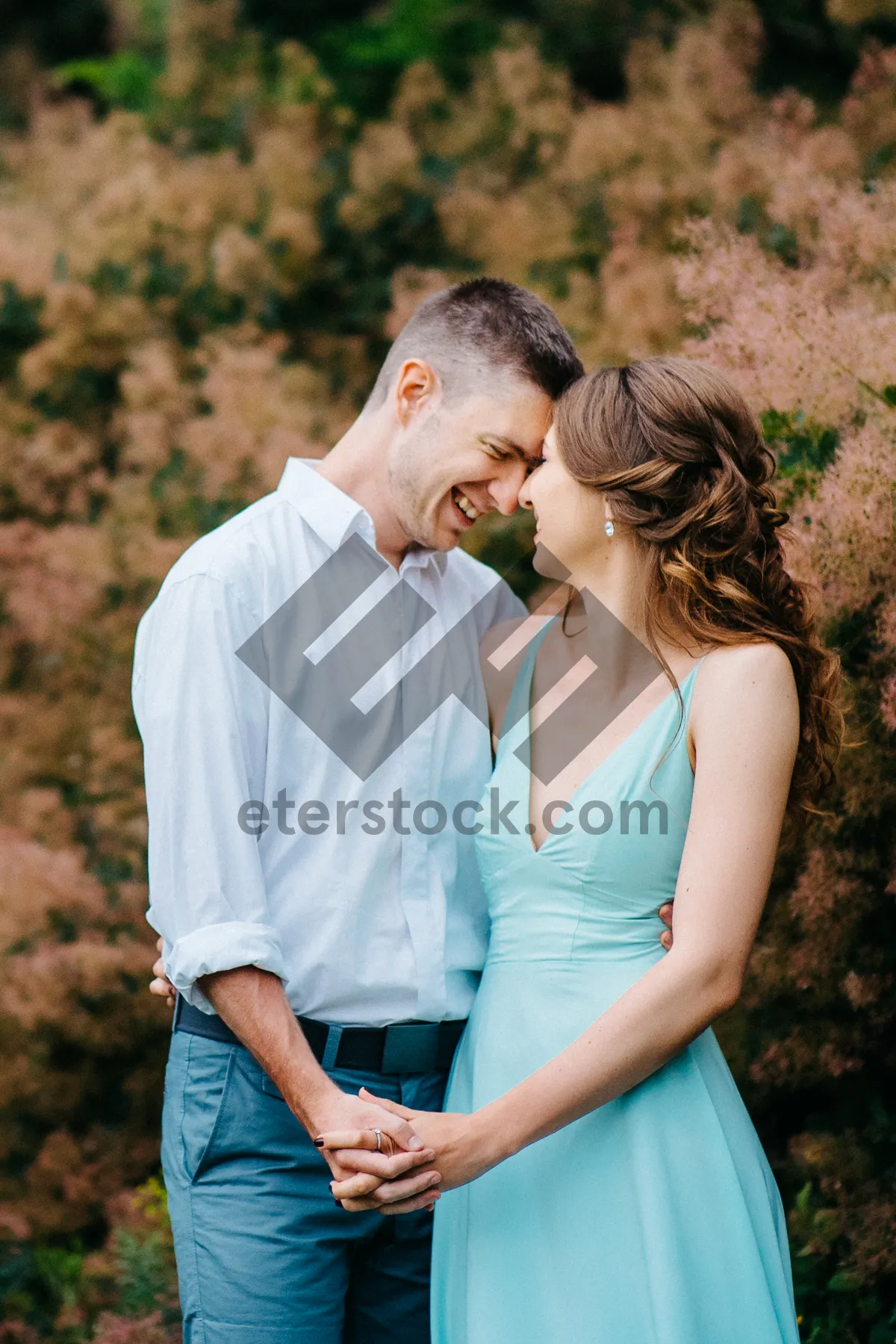 Picture of Happy couple enjoying a summer ice lolly outdoors.