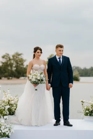 Happy couple outdoors on wedding day celebrating love