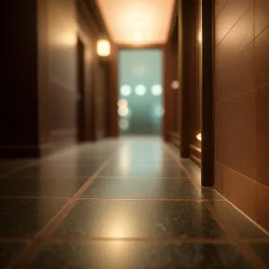 Modern Architectural Hallway with Illuminated Floor and Elevator