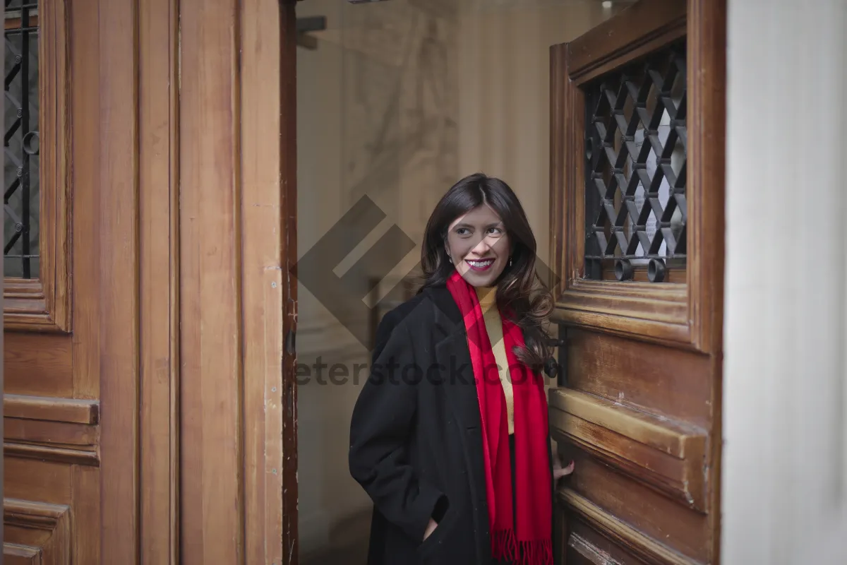 Picture of Smiling brunette businesswoman in professional trench coat