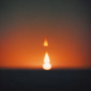 Glowing Sunlit Candle Flame
